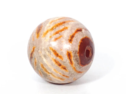 Ac-030623-DDIE carnelian dzi end, brown-red cinnabar bloodspot inclusions on terracotta-orange surface, unretouched