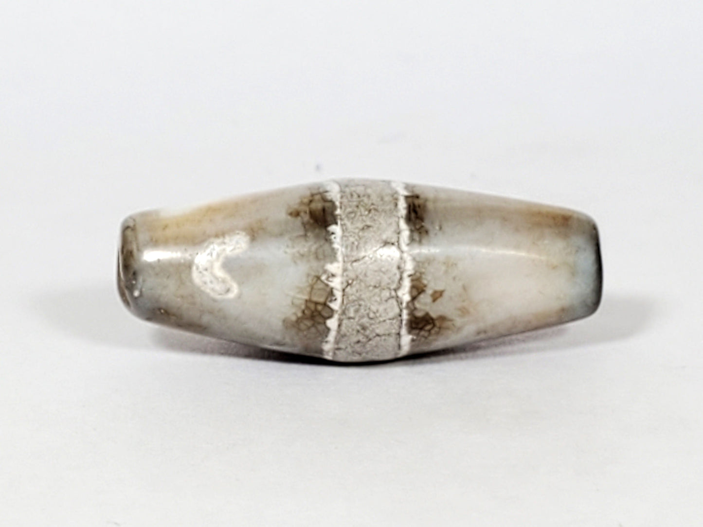 Ac-061526-1SPair, Bead A, 25.4×9.2mm, pale grey-white bicone, calcification stripe, honey-brown banding, unretouched
