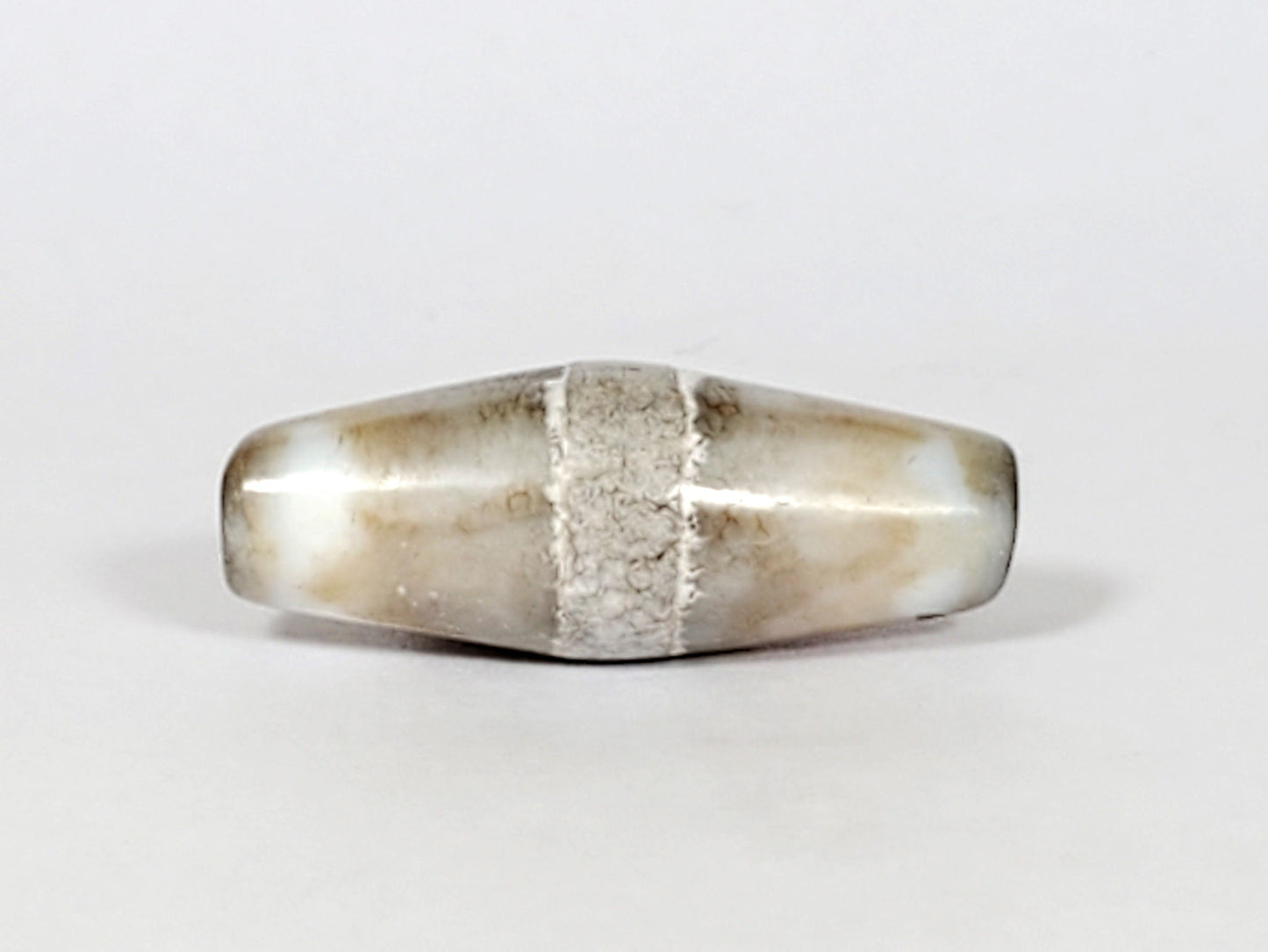 Ac-061526-1SPair, Bead A Face C, uniform pale grey-white ground, calcification band, bright mineral line visible, unretouched