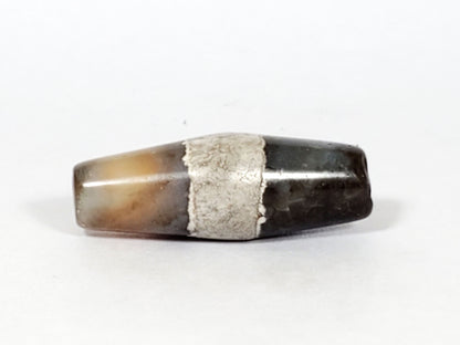 Ac-061526-1SPair, Bead A, 25.4×9.2mm, pale grey-white bicone, calcification stripe, honey-brown banding, unretouched