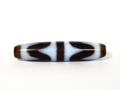 N-062226-DW3, face B, very deep dark brown agate, bilateral wave forms flanking central bar, cool white field, unretouched