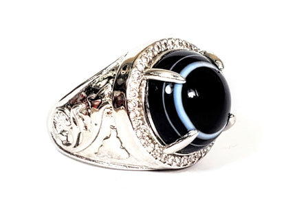 R-060626-LM Luk Mik dzi ring, 13.7mm pitch-black bead, blue-grey stripe, CZ halo, dragon shank, unretouched