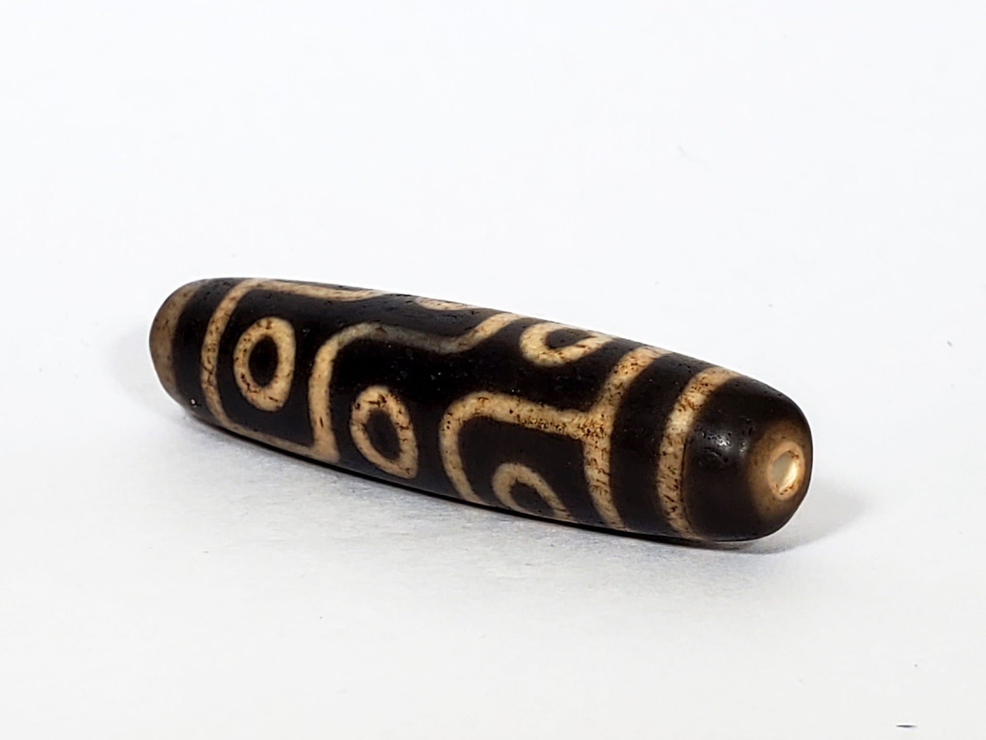 V-FA-062026-9E opposite lateral face, continuous eye meander