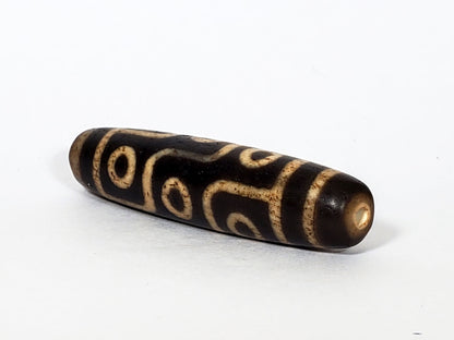 V-FA-062026-9E opposite lateral face, continuous eye meander