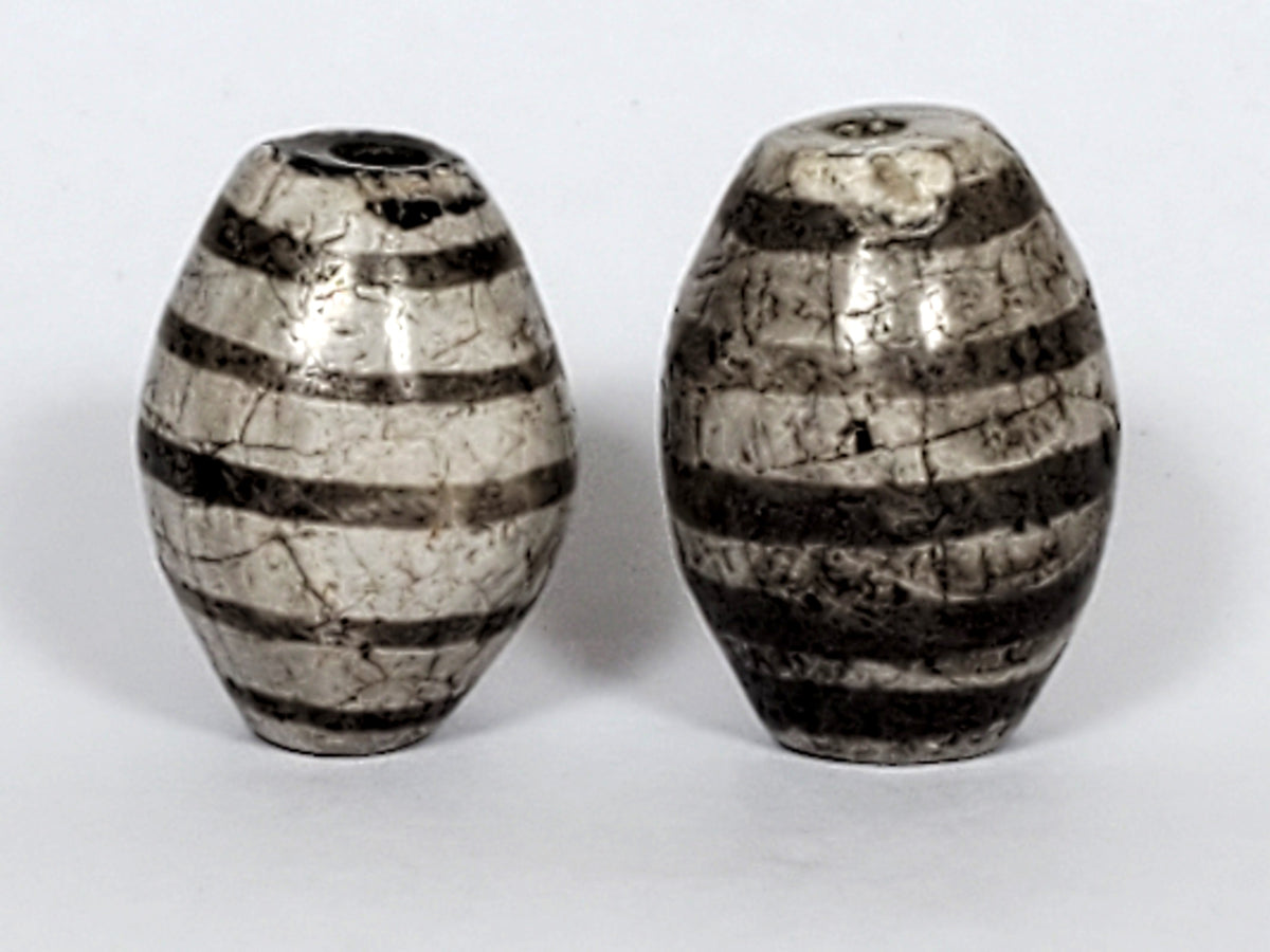 Ac-062626-9SChung2 pair ancient nine stripe Chung dzi, third face view, charcoal-grey stripe zones, cracklines, unretouched