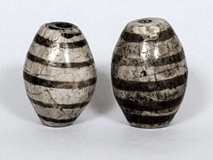 Ac-062626-9SChung2 pair ancient nine stripe Chung dzi, third face view, charcoal-grey stripe zones, cracklines, unretouched