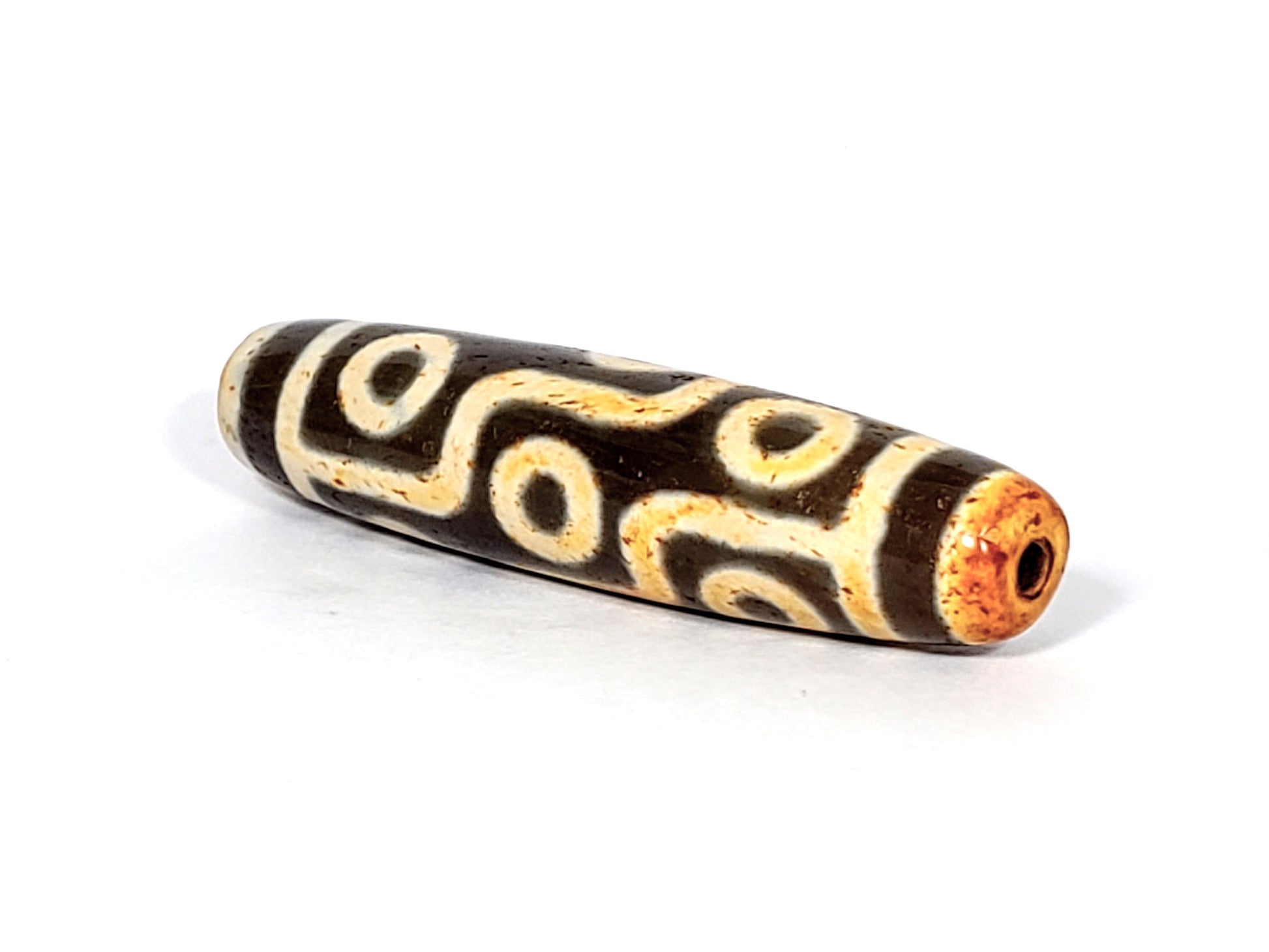 V-FA-062026-9EA2 angled view, amber-orange drill opening, clean