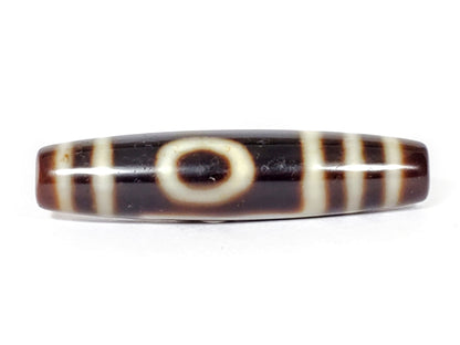 V-070226-OEM vintage one eye mountain dzi bead, front view, dark brown ground, cream eye motif, 48.6×11.3mm, unretouched.