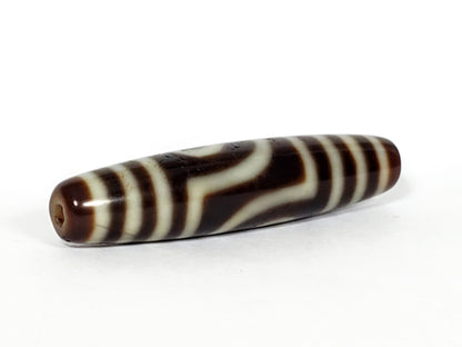 V-031122-2E dzi bead, diagonal view showing drill hole and full stripe pattern, unretouched.