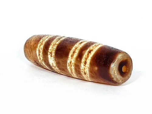 Ac-031322-7SChung, right end 3/4 view, warm honey-brown end cap, drill hole, cylindrical body girth, unretouched