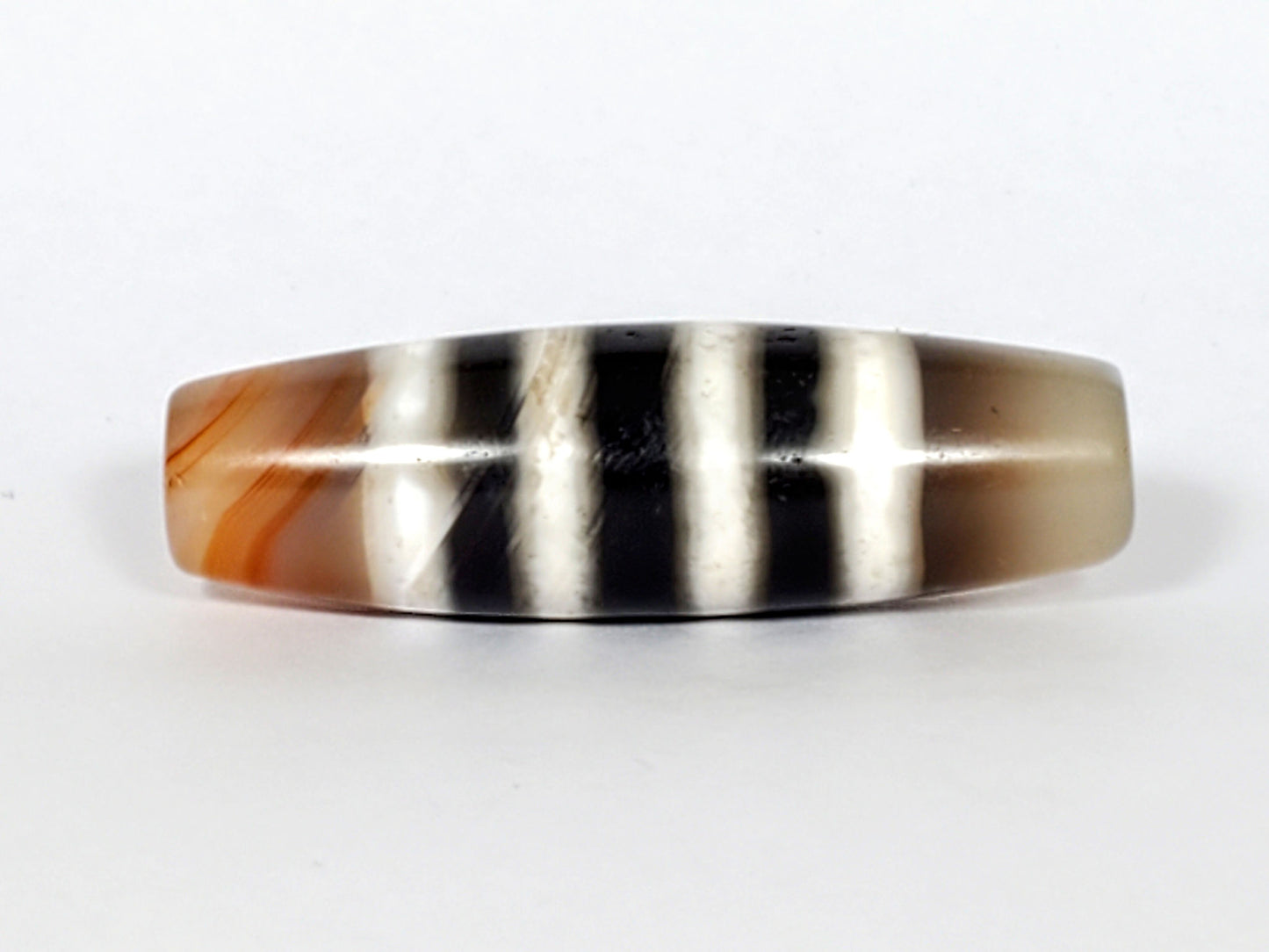 N-050222-7SChung, Face B lower profile, mirror-gloss black and white stripe composition, warm brown left end cap, unretouched