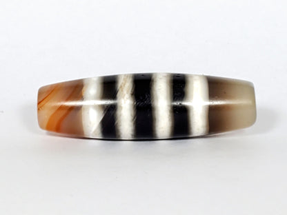 N-050222-7SChung, Face B lower profile, mirror-gloss black and white stripe composition, warm brown left end cap, unretouched