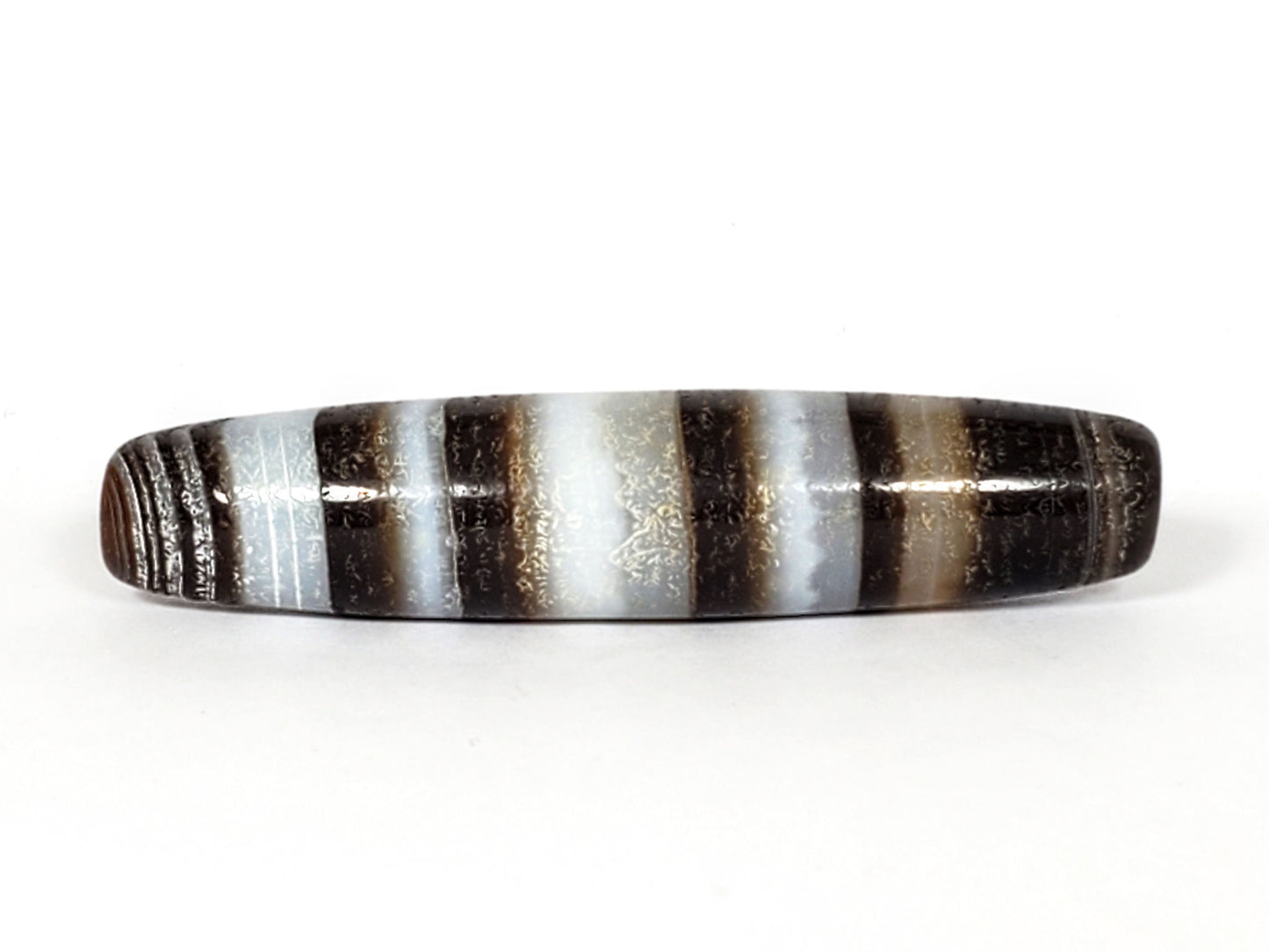N-N-062126-CS1 natural agate dzi, angled view, alternating dark and pale band sequence, unretouched