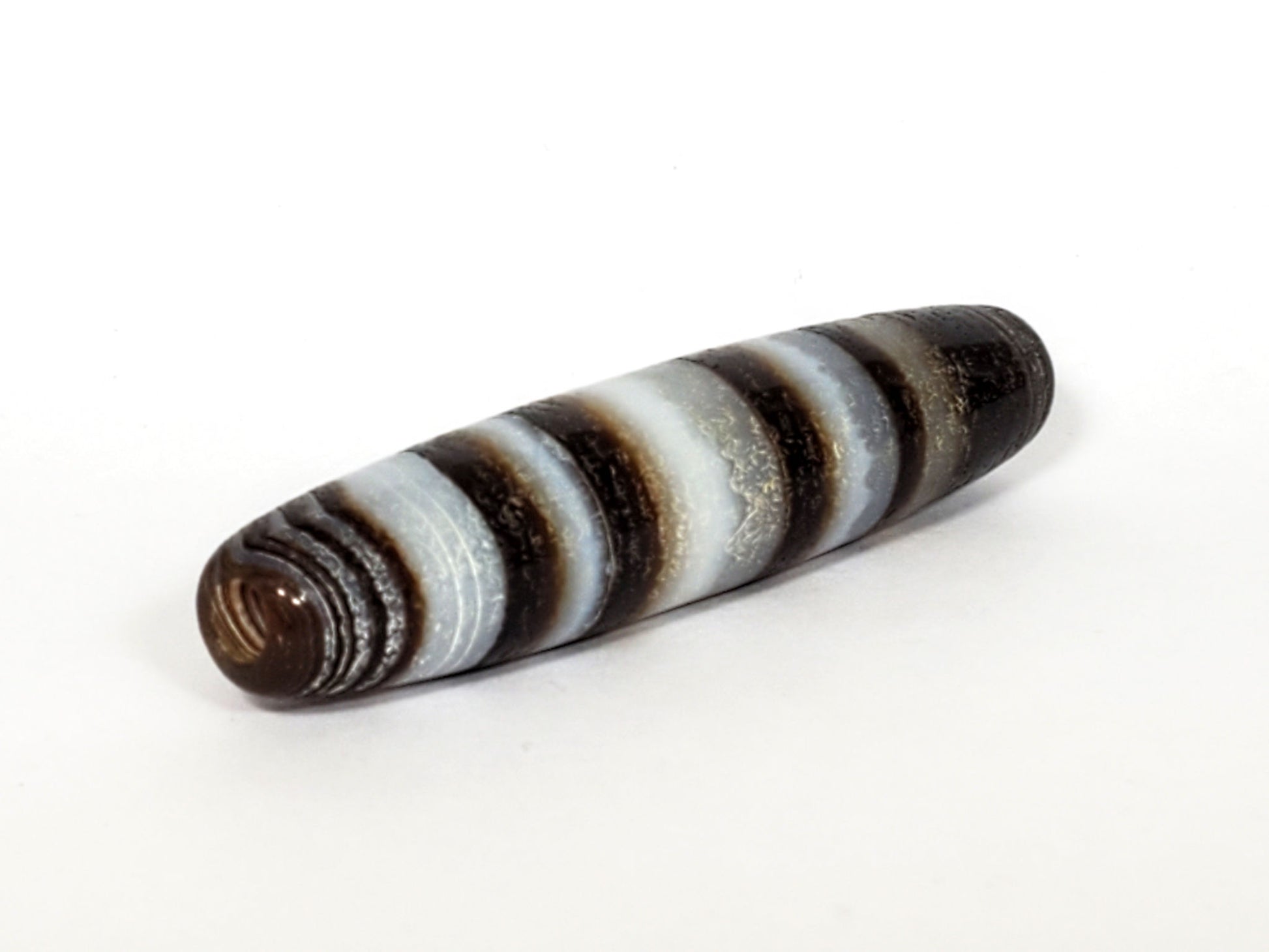 N-N-062126-CS1 natural agate dzi, three-quarter angle showing opposite drill hole, full band sequence, unretouched