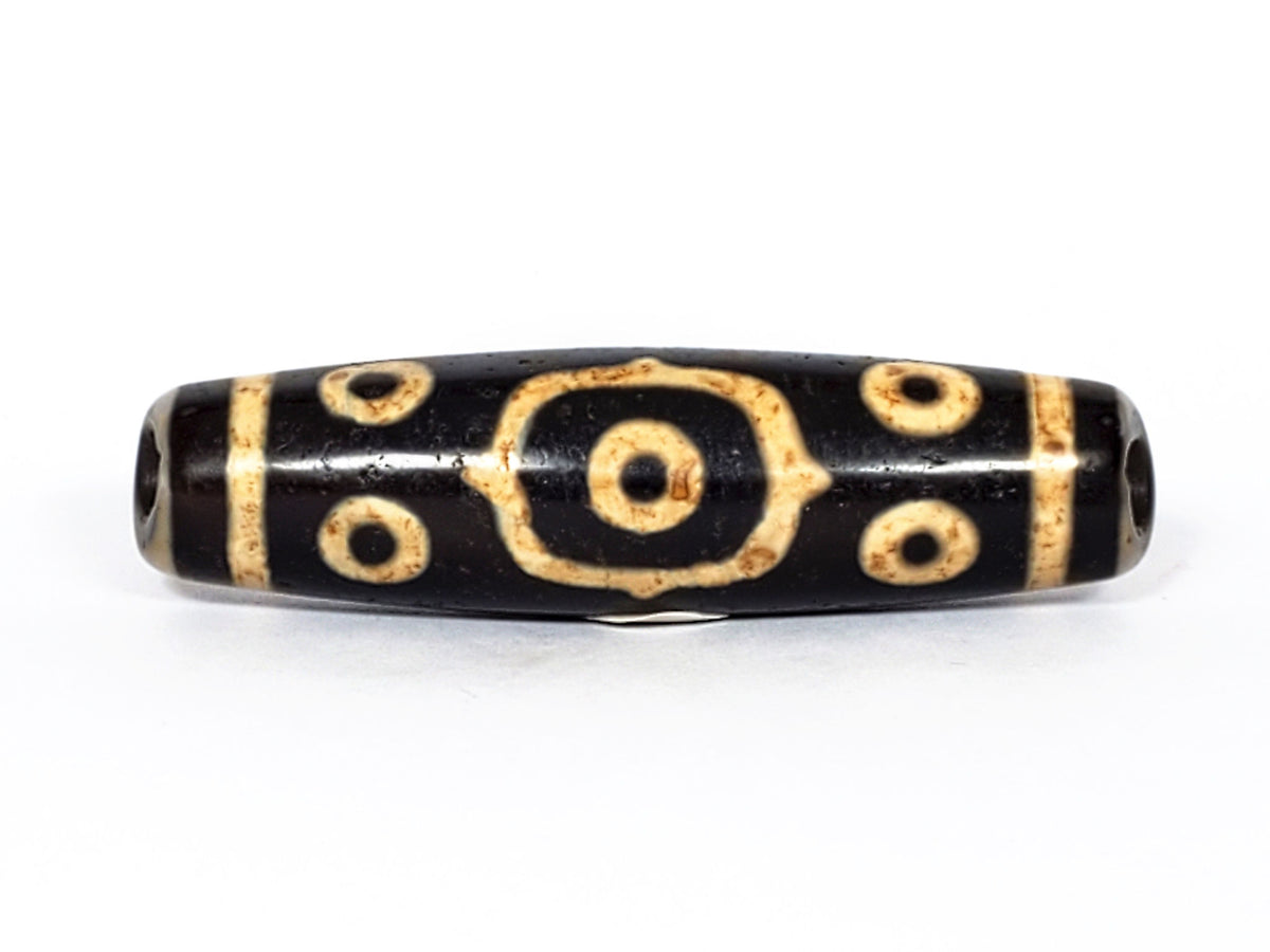V-FA-062126-14E-LK dzi bead, close side profile showing octagonal-framed eye detail, unretouched