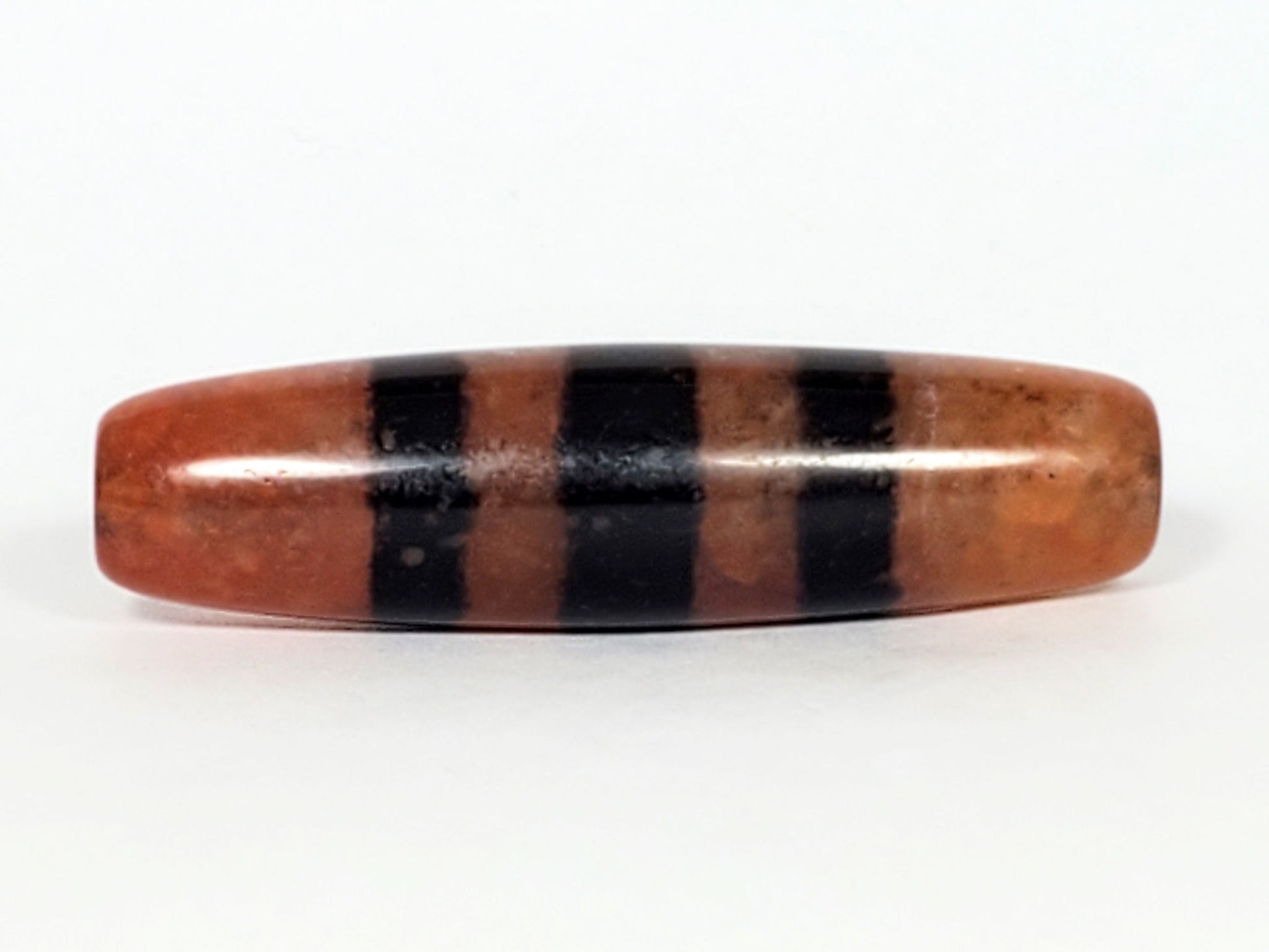 At-070622-5SChung, Face B, lower profile, wide black stripes over terracotta reddish-brown, semi-gloss surface, unretouched