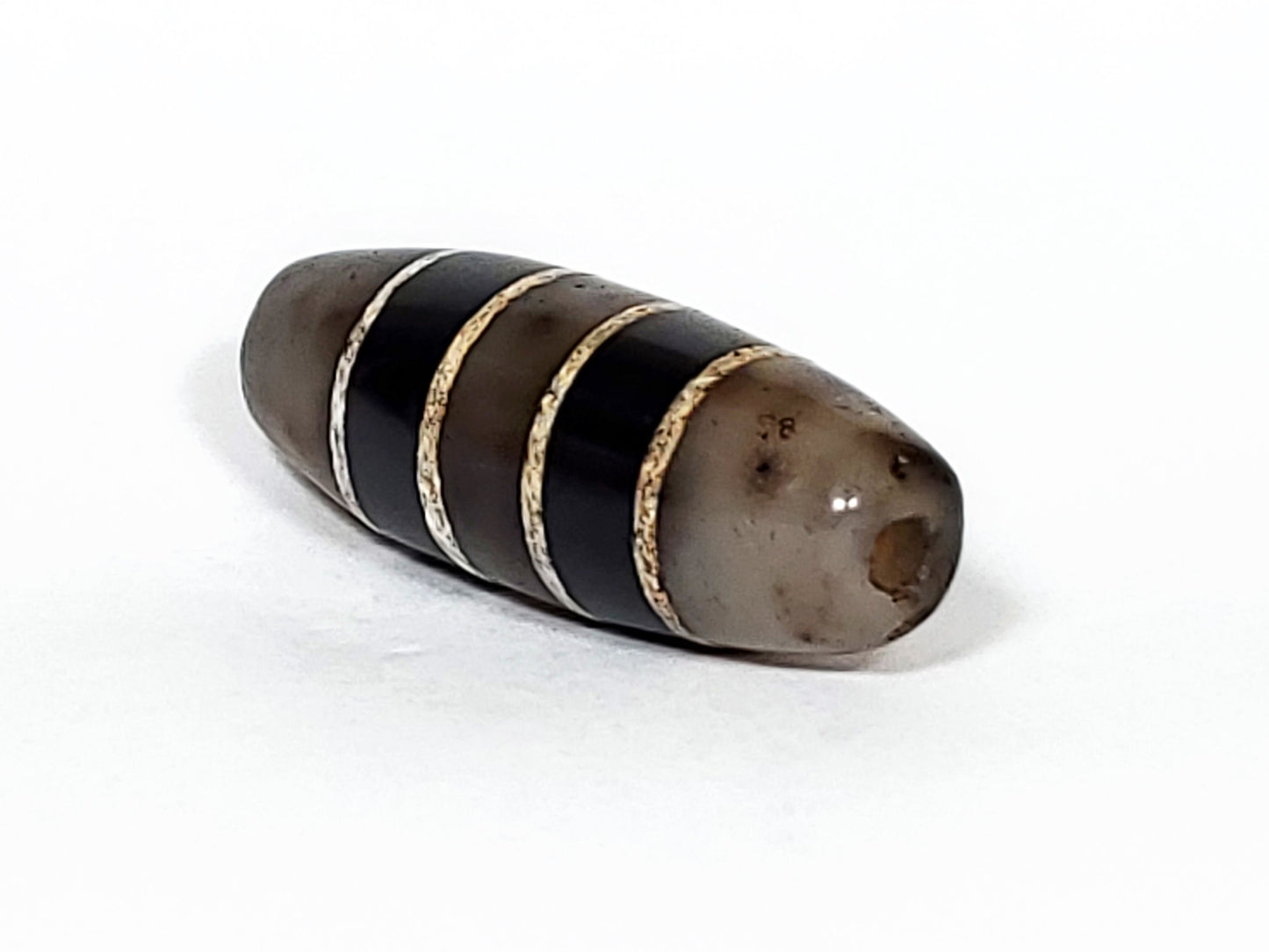 Ac-101922-7SChung, right tip, translucent cool grey end cap, drill hole, ink inscription disclosed, unretouched