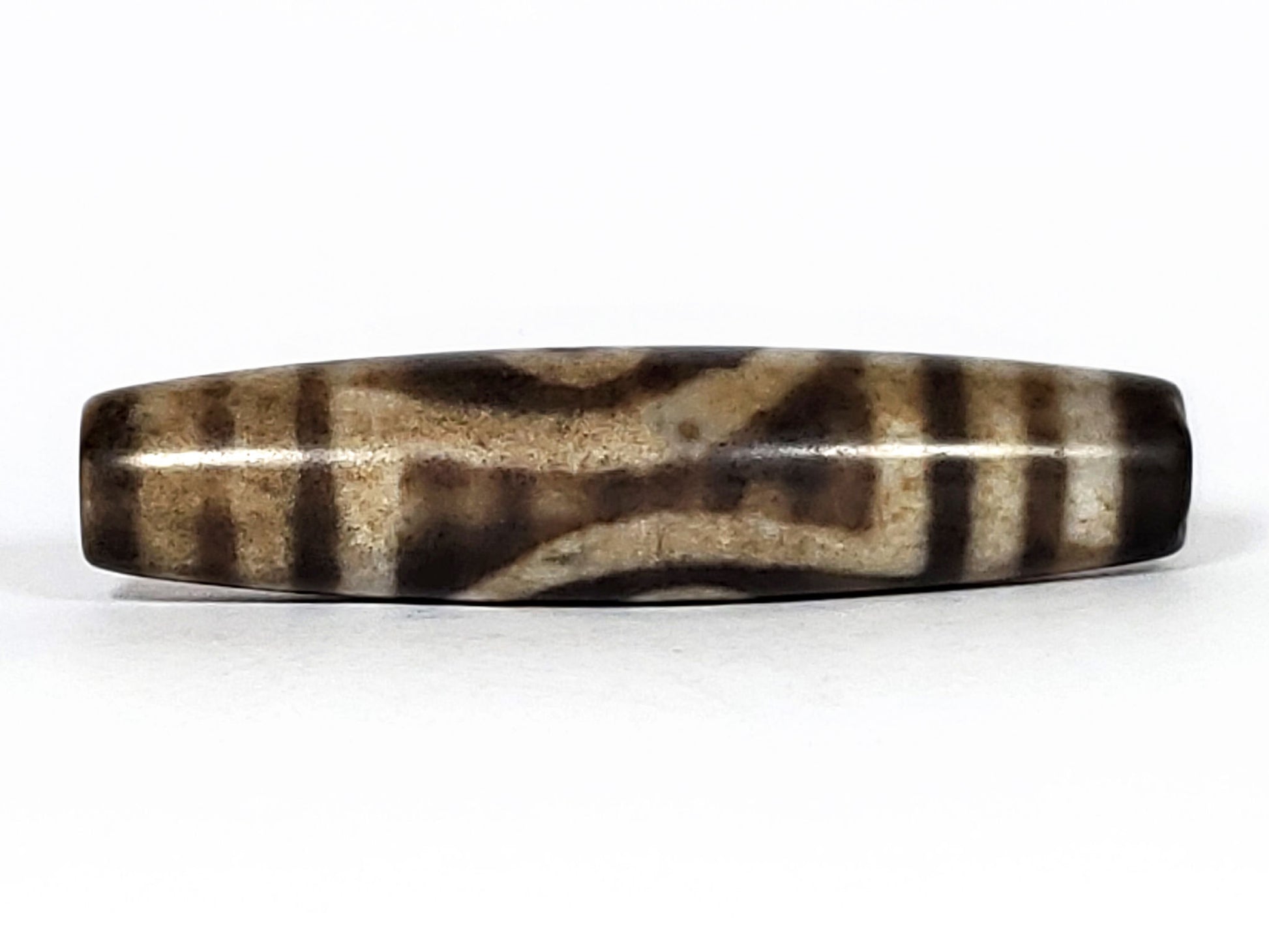 N-062126-2E2 dzi bead, opposite side profile, second eye face, unretouched