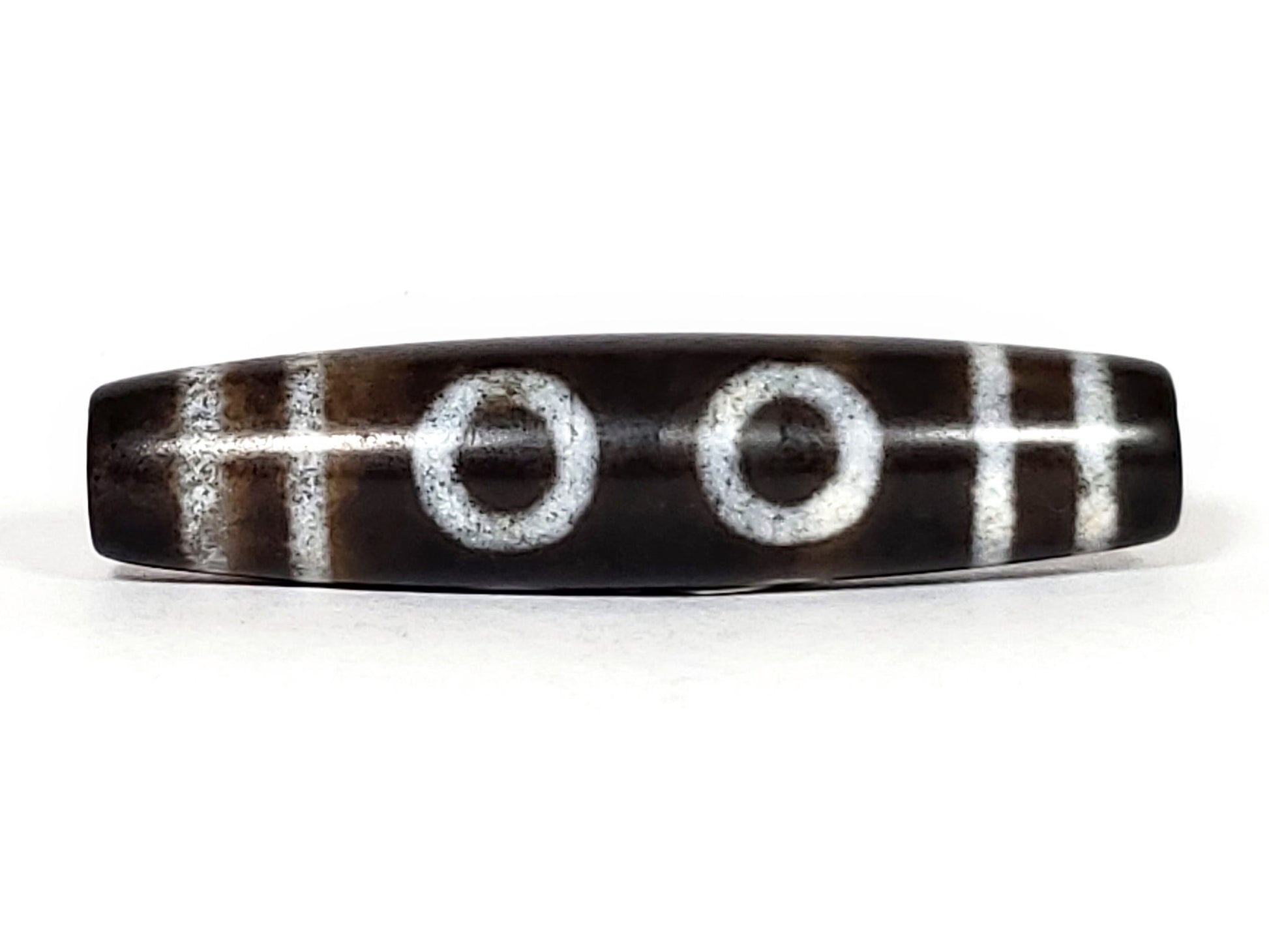 N-062226-6E, face C, six eye motif dzi, very dark brown agate, muted off-white ring eyes, asymmetric taper, unretouched