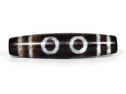 N-062226-6E, face C, six eye motif dzi, very dark brown agate, muted off-white ring eyes, asymmetric taper, unretouched