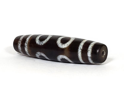 N-062226-6E, angled side view, open C-curve reading visible, drill hole at tapered tip, very dark brown, unretouched