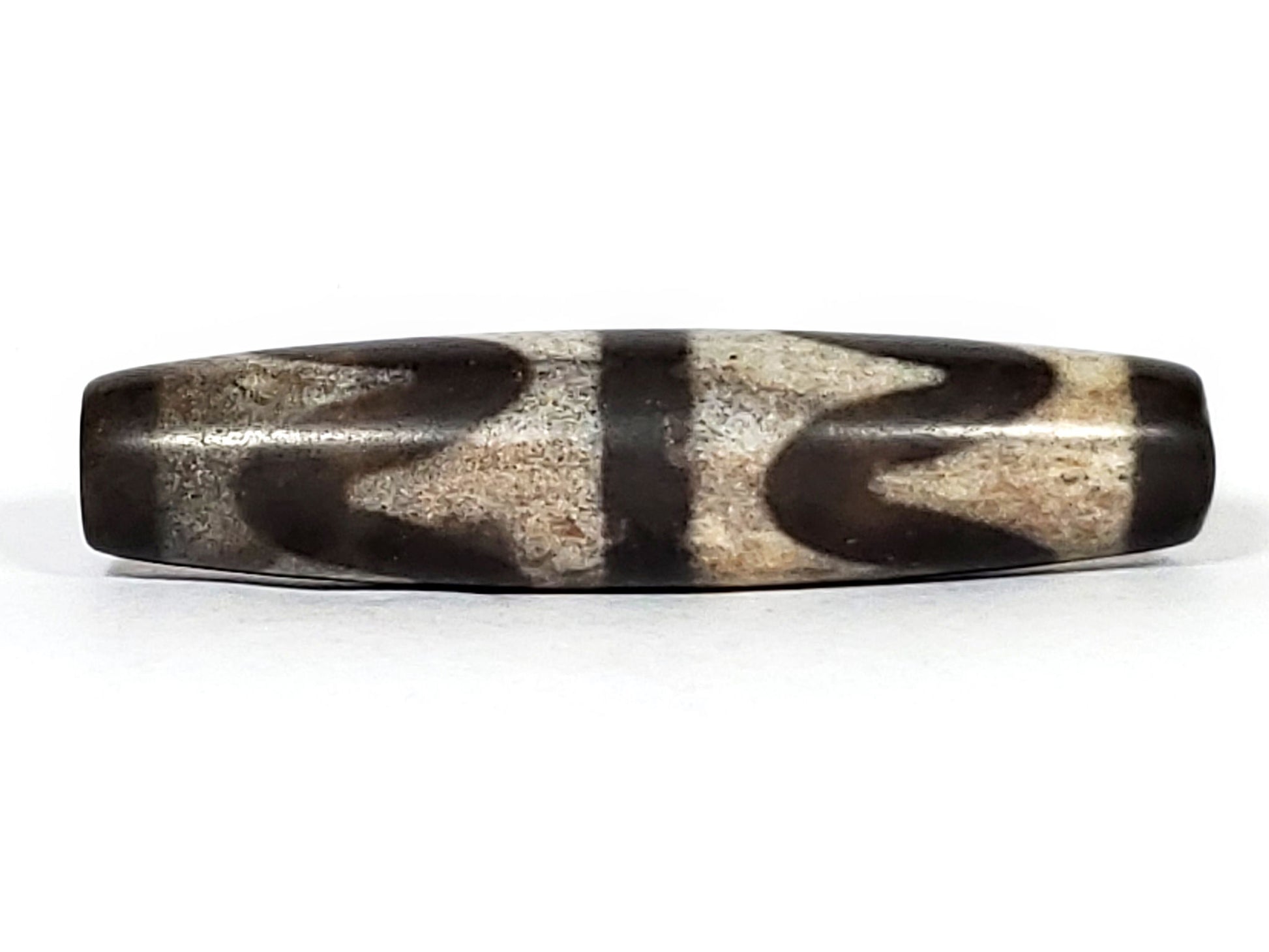 N-062226-DW2, face A close, open wave arc sandy-beige field on very dark brown ground, central bar, unretouched