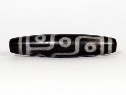 N-062226-9E, nine eye agate dzi, 57.7×12.9mm, deep cool grey-black, silvery-grey motif, face A, unretouched
