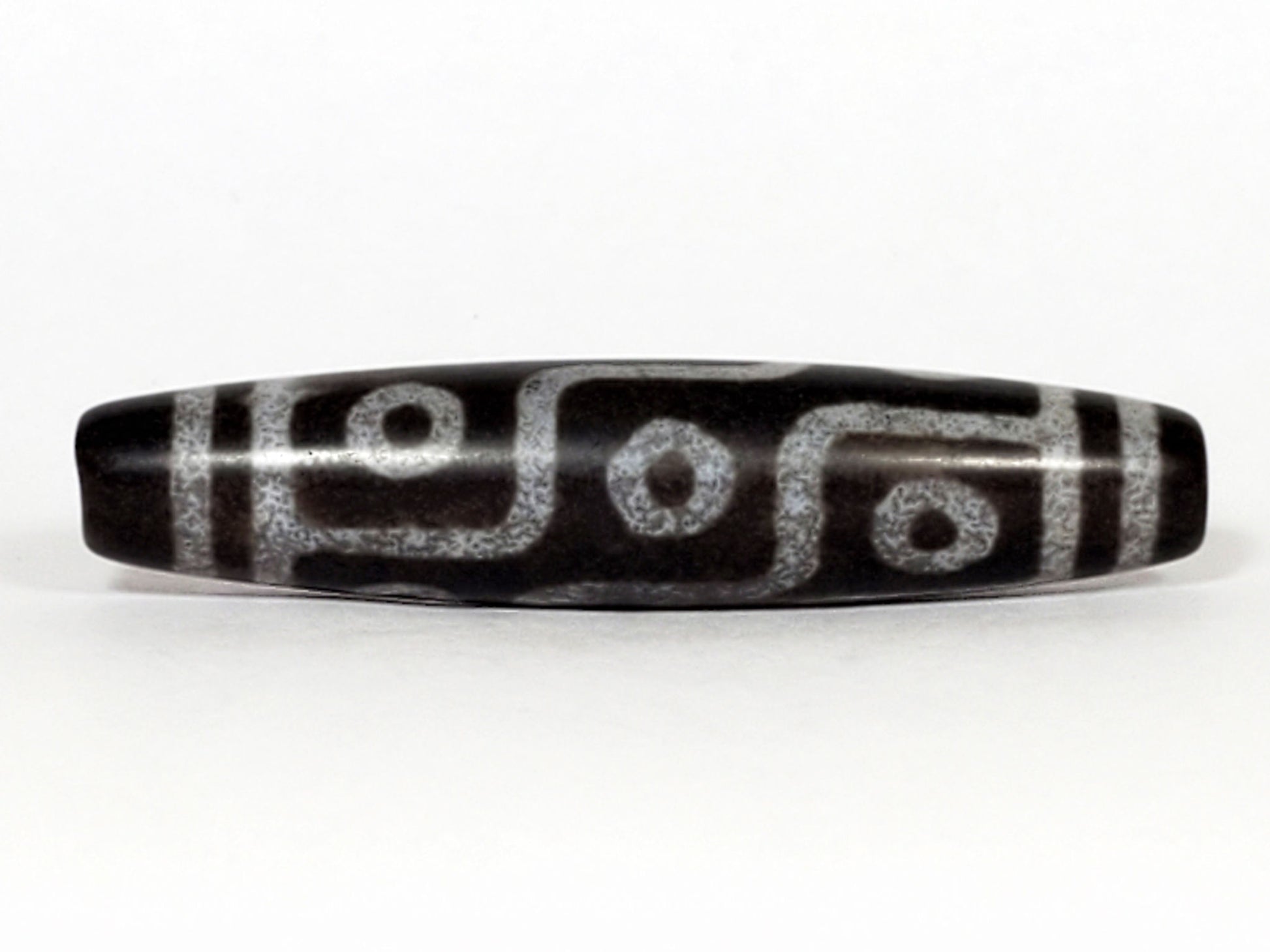 N-062226-9E, face B, nine eye flowing curved-line motif, cool grey-black ground, pale silvery-grey lines, unretouched