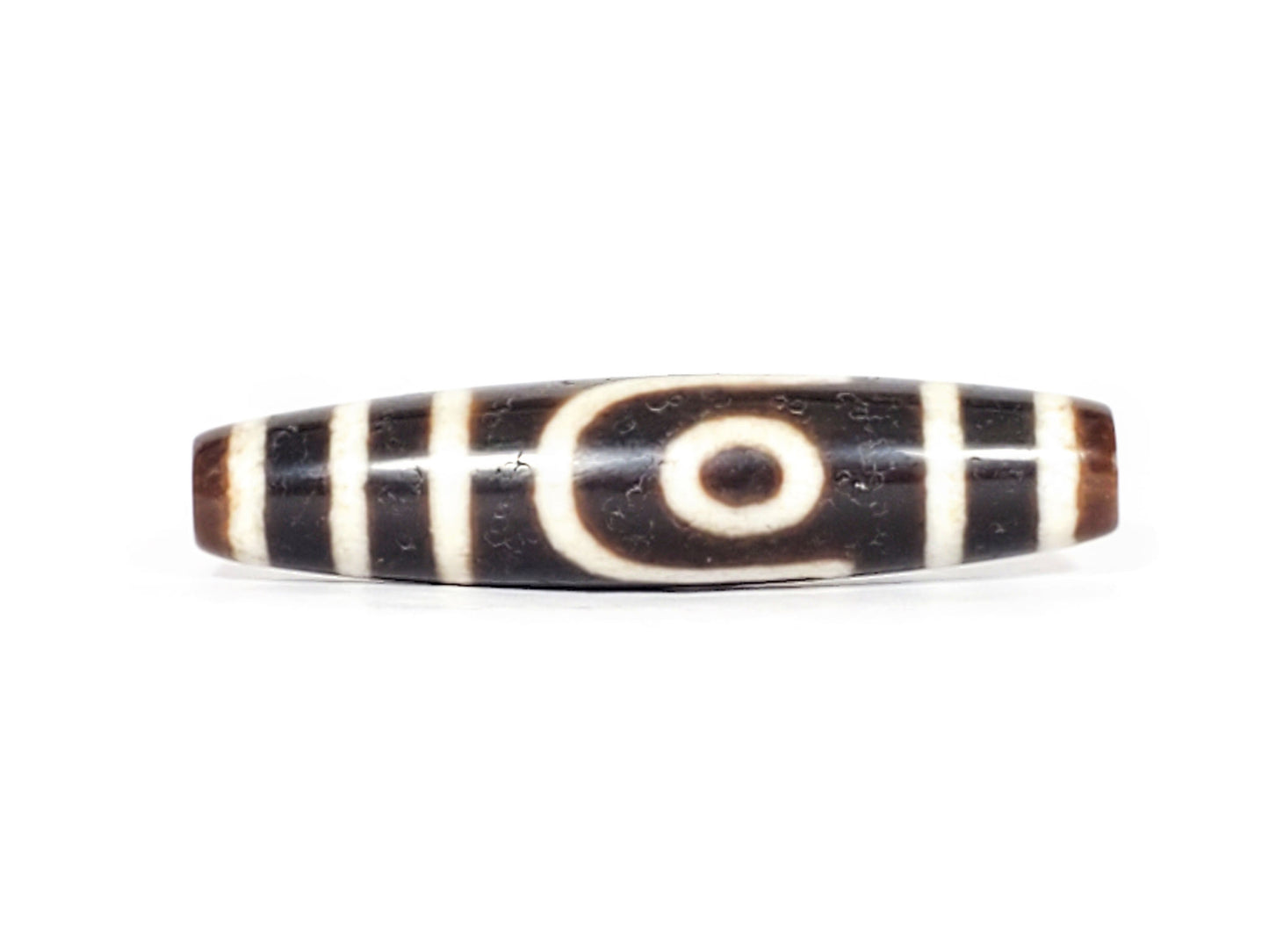 V-070426-2E3 vintage two eye dzi bead, front view, brown to black ground, 52.7×12.2mm, unretouched.