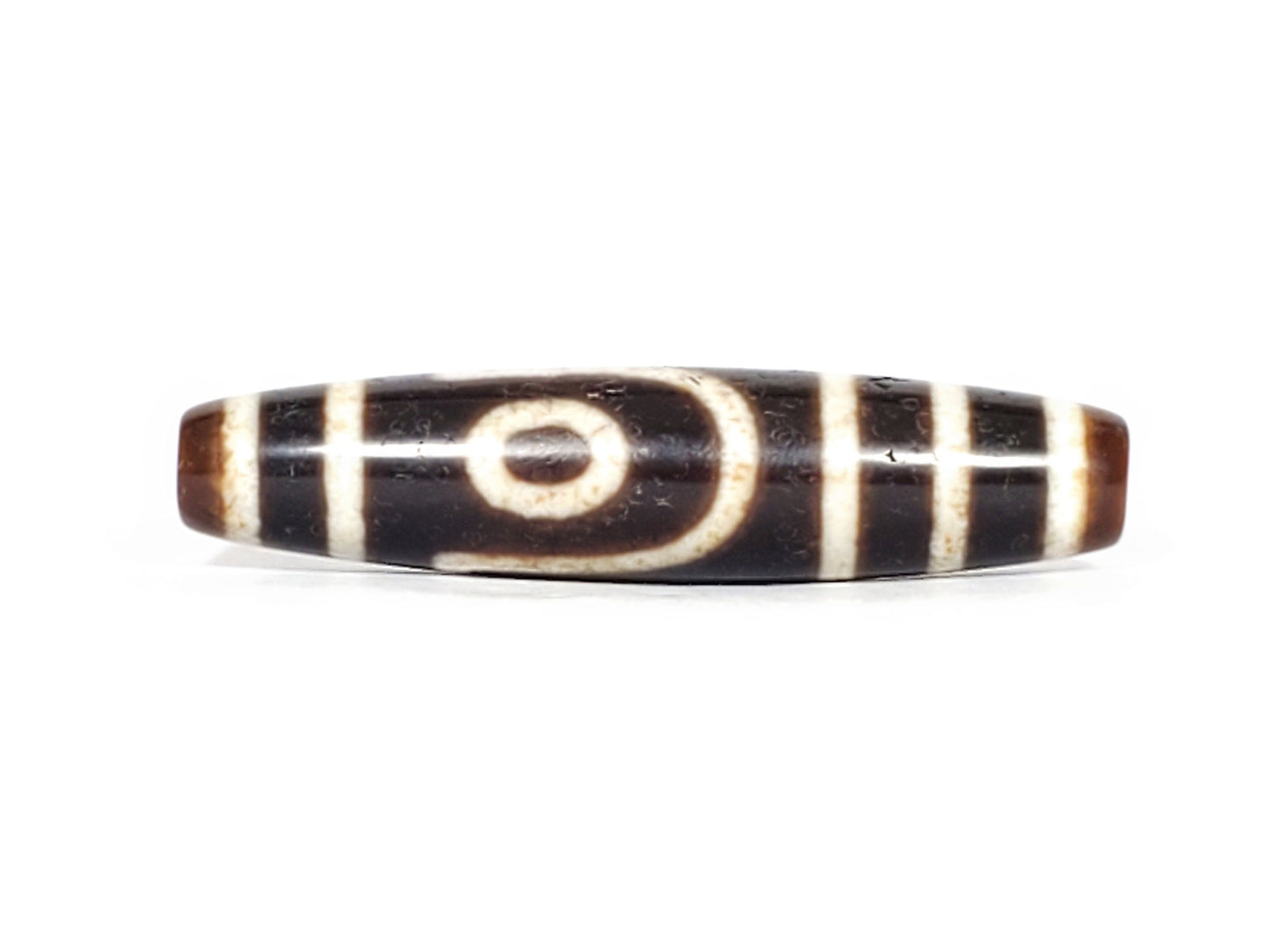 V-070426-2E3 dzi bead, front view showing stepped-line face, brown-black agate, unretouched.