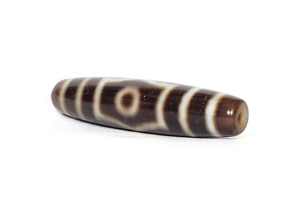 V-070226-ThE-003 dzi bead, diagonal view showing single eye face, dark brown agate, unretouched photo.