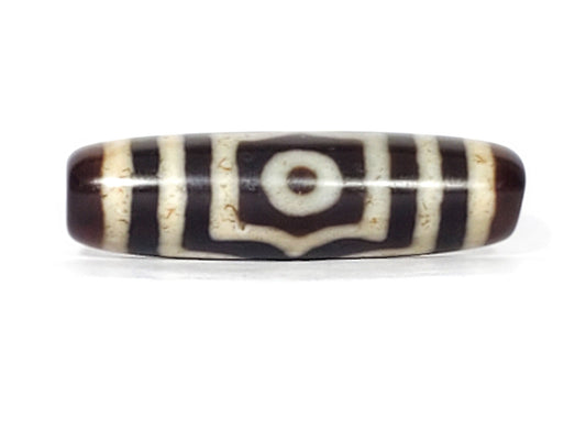 V-070226-3E vintage three eye dzi bead, front view, dark brown and black ground, 41.3×11.9mm, unretouched.