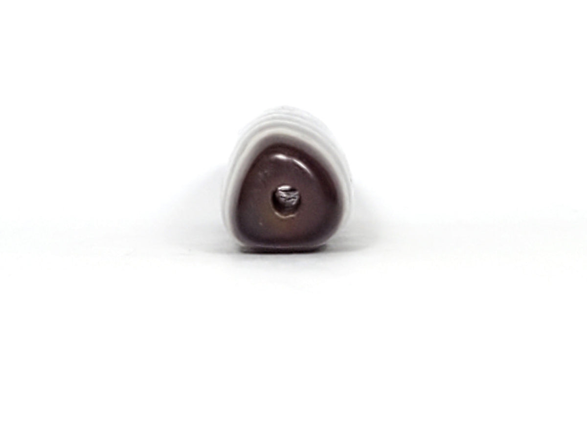 V-070226-3E dzi bead, end view showing triangular cross-section and drill hole, unretouched.
