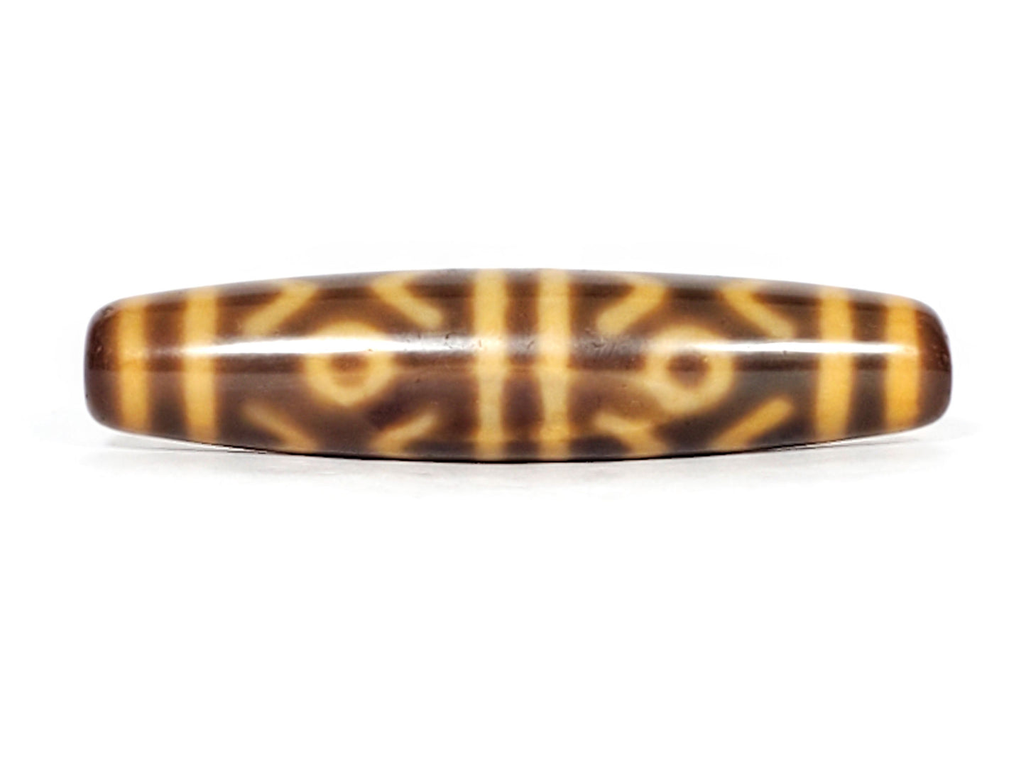 At-053126-6ETT, third-face rotation, six eye tiger tooth composition, honey-gold motif lines, 57.9mm spindle, unretouched