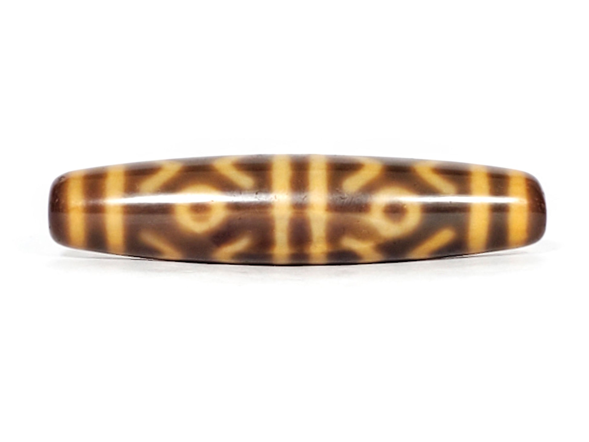 At-053126-6ETT, third-face rotation, six eye tiger tooth composition, honey-gold motif lines, 57.9mm spindle, unretouched