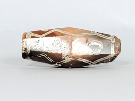 Ac-030223-12E ancient 12-eye hexagonal carnelian dzi 28.2×9.3mm bicolour terracotta-orange grey-brown, unretouched