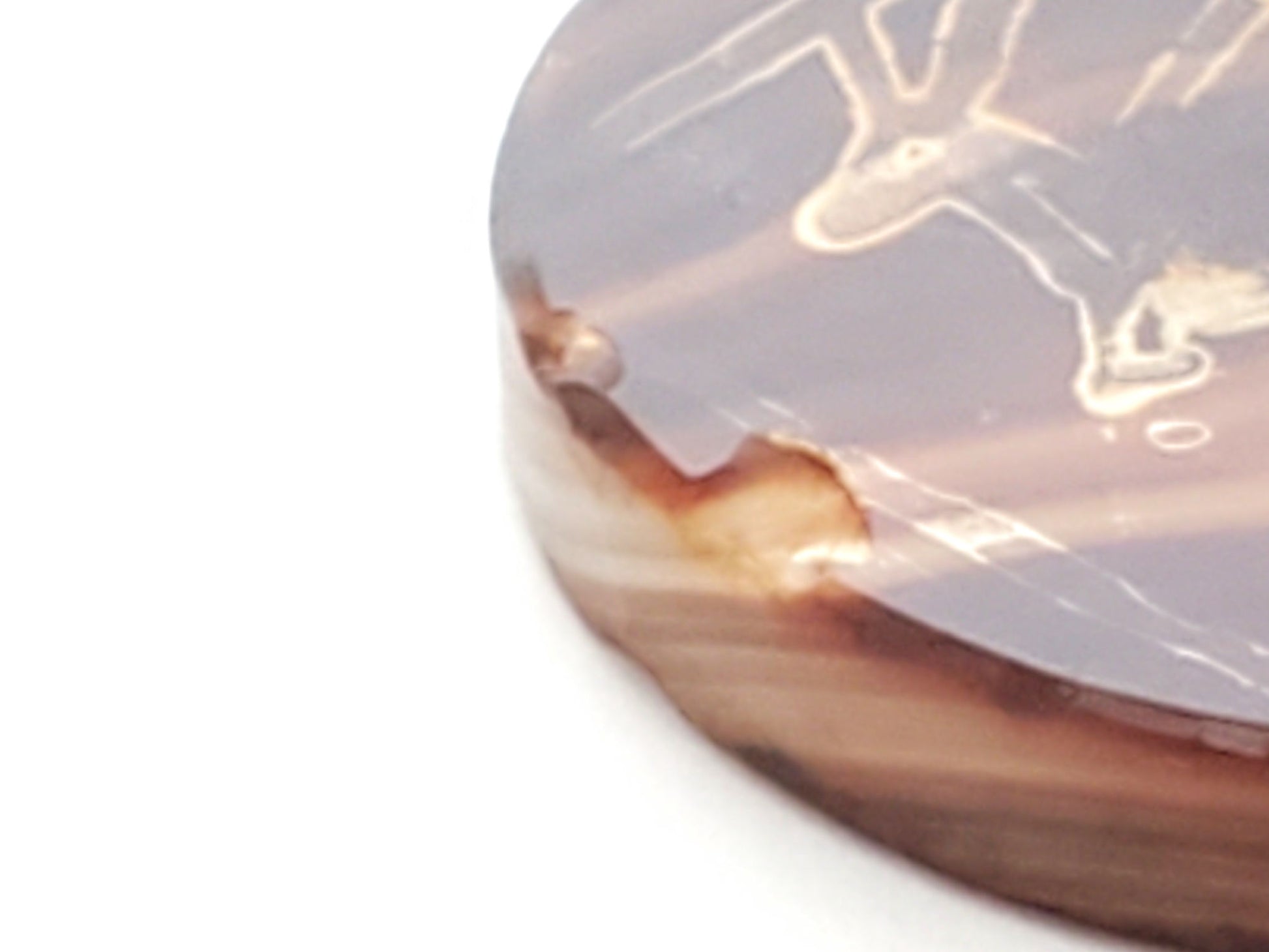 At-062926-DD chip detail 1, conchoidal edge fracture, raw carnelian interior exposed at rim, unretouched