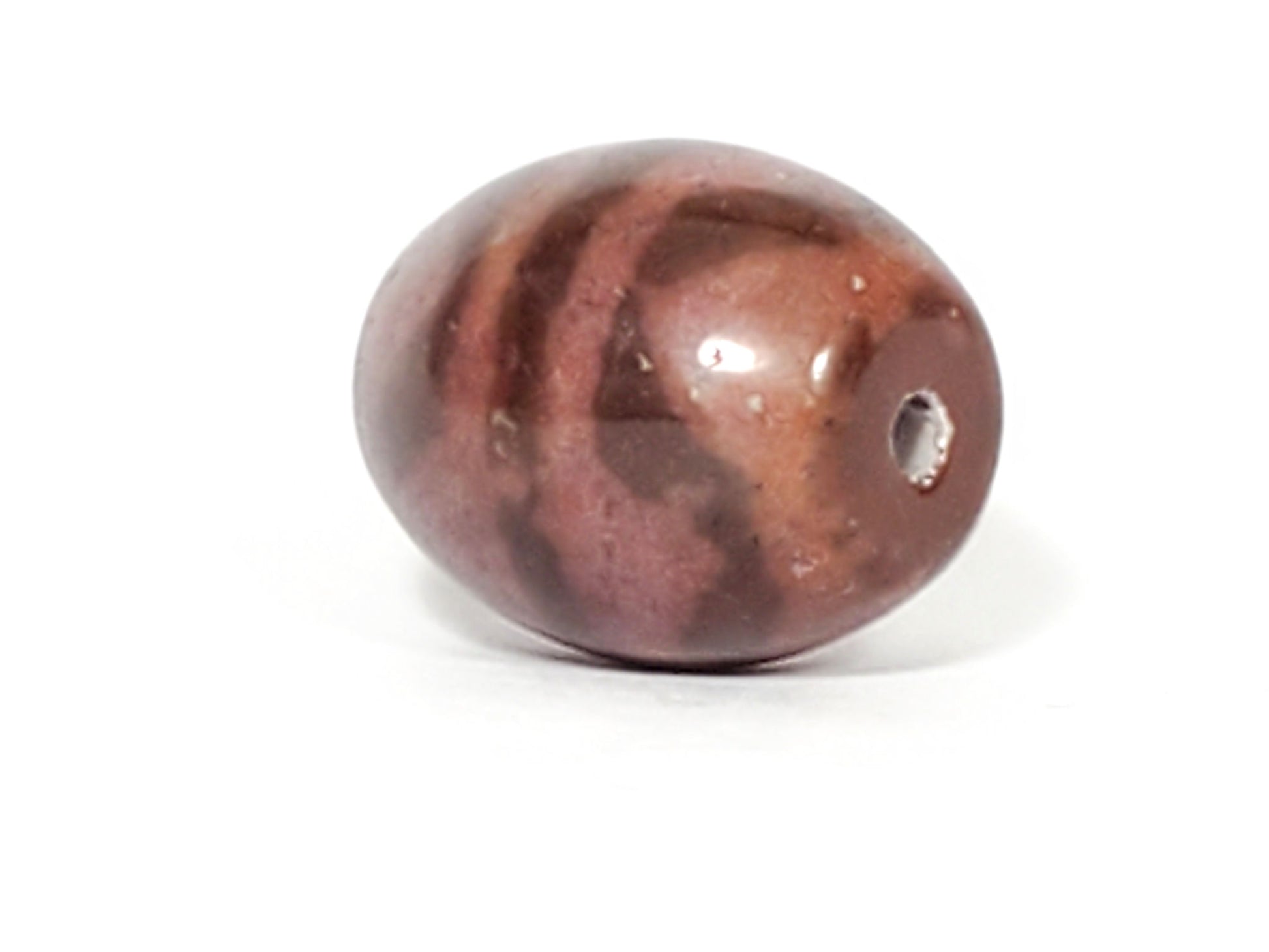 N-062926-TT, top view with drill hole, rose-red agate round tiger tooth dzi bead, banding wraps crown, unretouched
