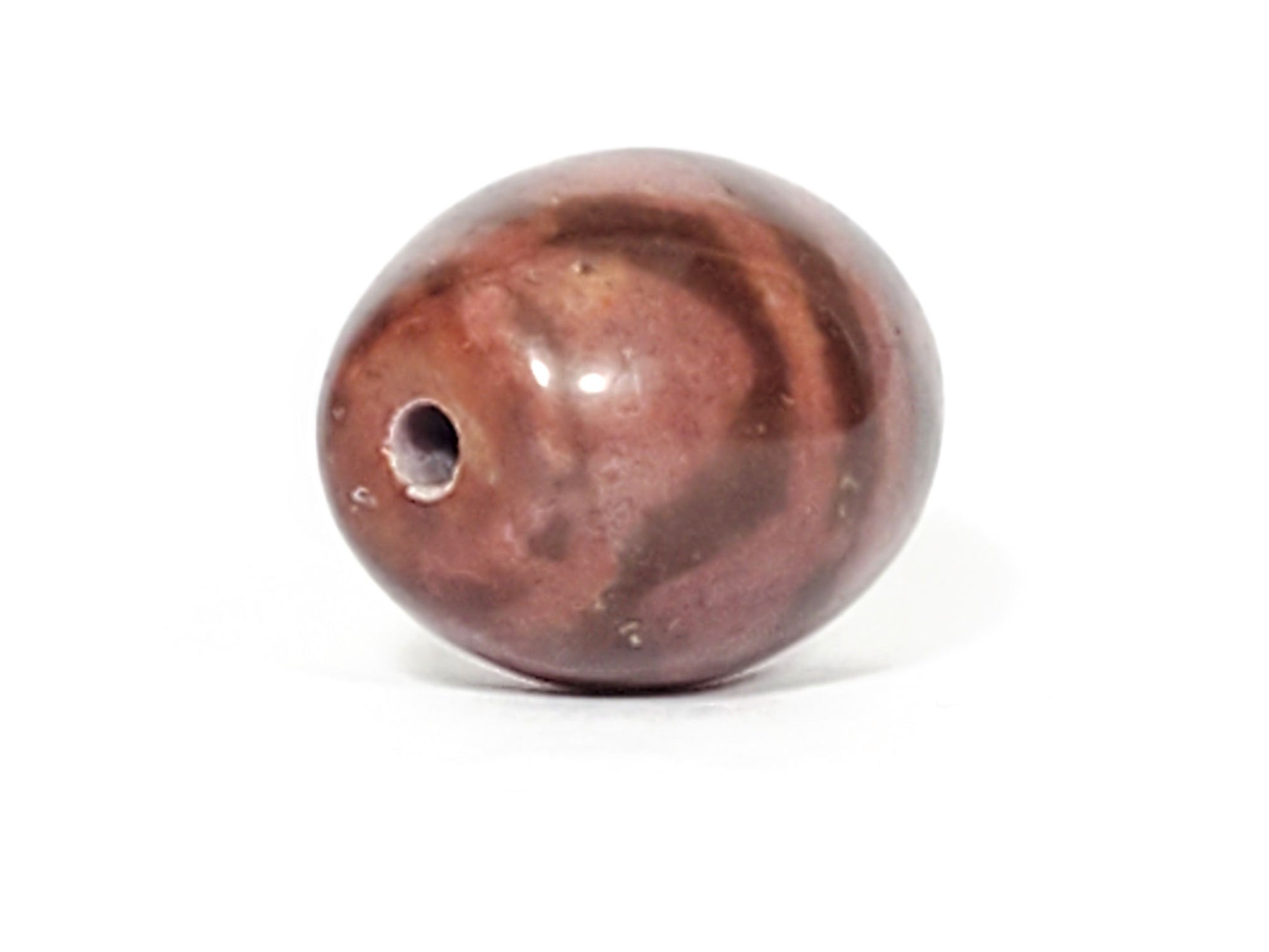 N-062926-TT, drill-end side view, rose-red agate round tiger tooth dzi bead, standard drilling, banding flows across surface, unretouched