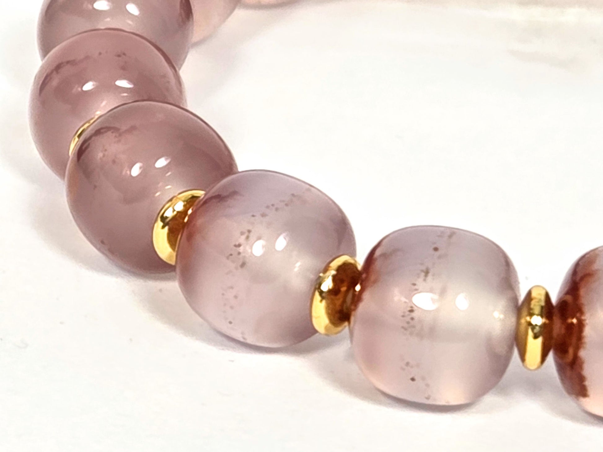 N-020726-CB3 arc detail, near-translucent blush-lavender chalcedony beads, gold spacers, minor cinnabar, unretouched