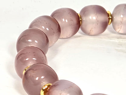 N-020726-CB3 arc, palest near-translucent blush-lavender beads, fine cinnabar micro-dots, gold spacers, unretouched