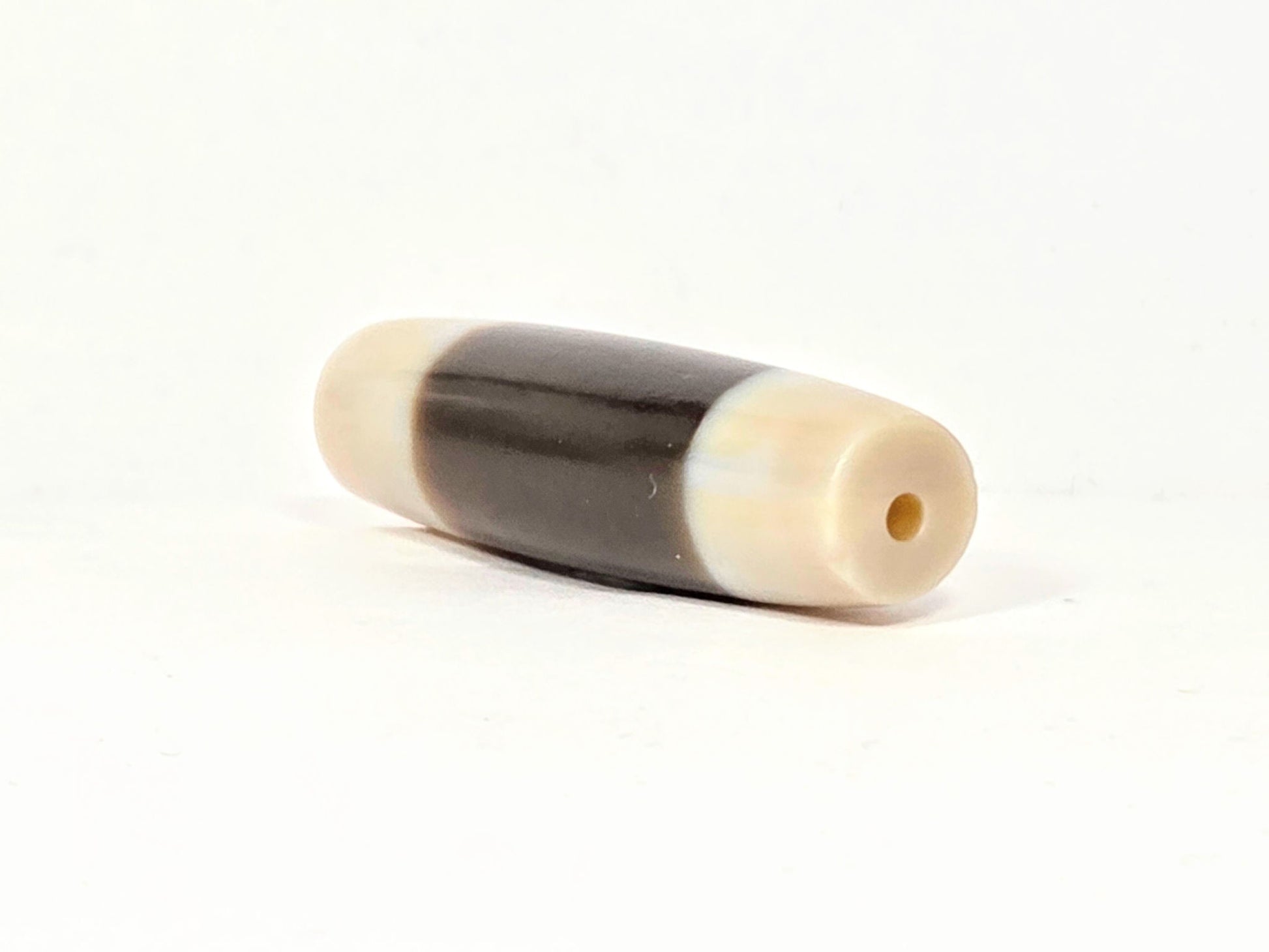 At-020726-Chung antique Chung dzi, right end cap, ivory-cream drill hole view, clean centred hole, unretouched
