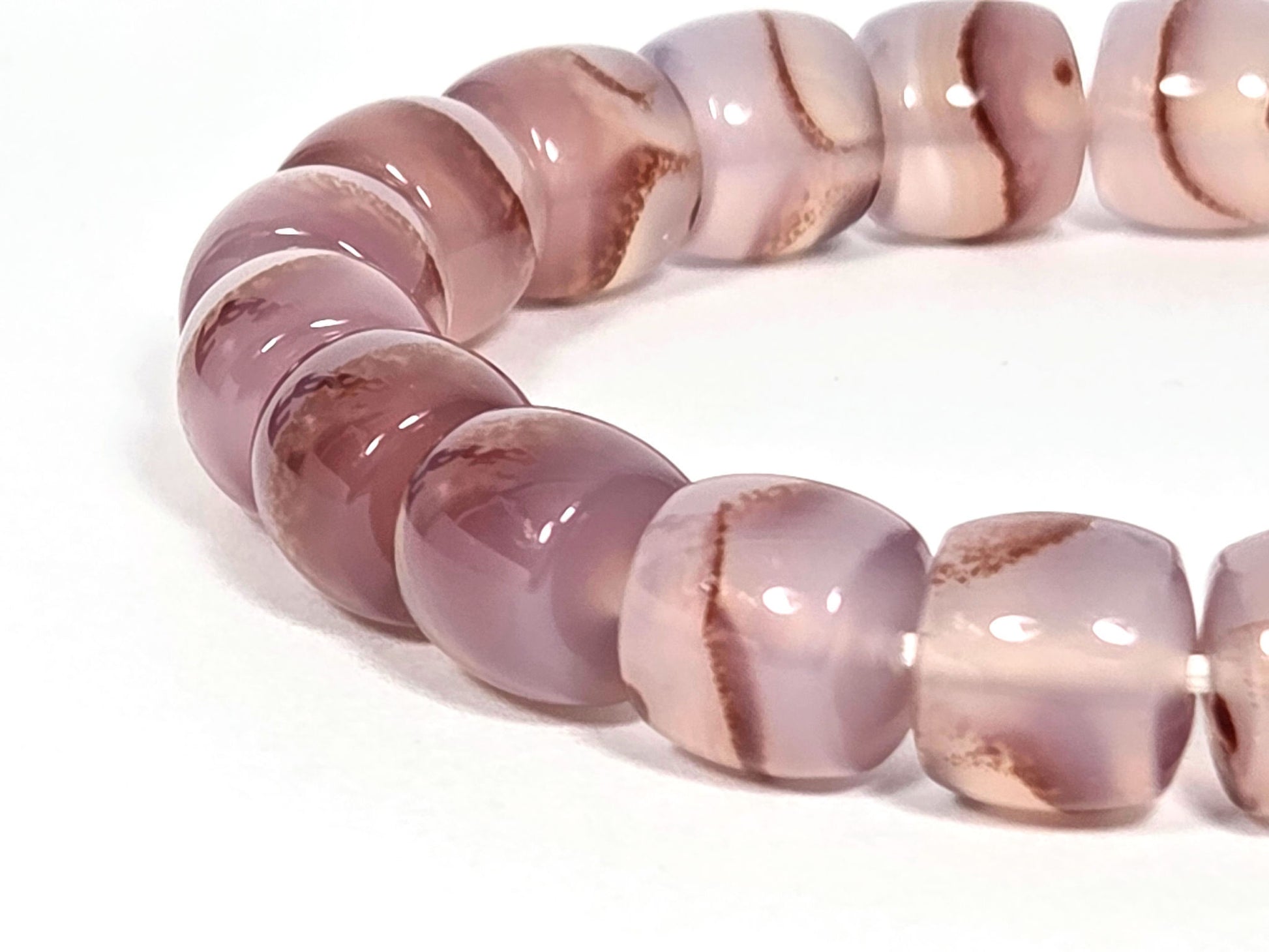 N-030526-CB side arc, semi-translucent mauve-rose chalcedony, internal warm brown banding, unretouched