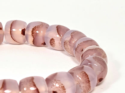 N-030526-CB side arc detail, warm brown banding and cinnabar zones in glossy mauve-rose chalcedony, unretouched