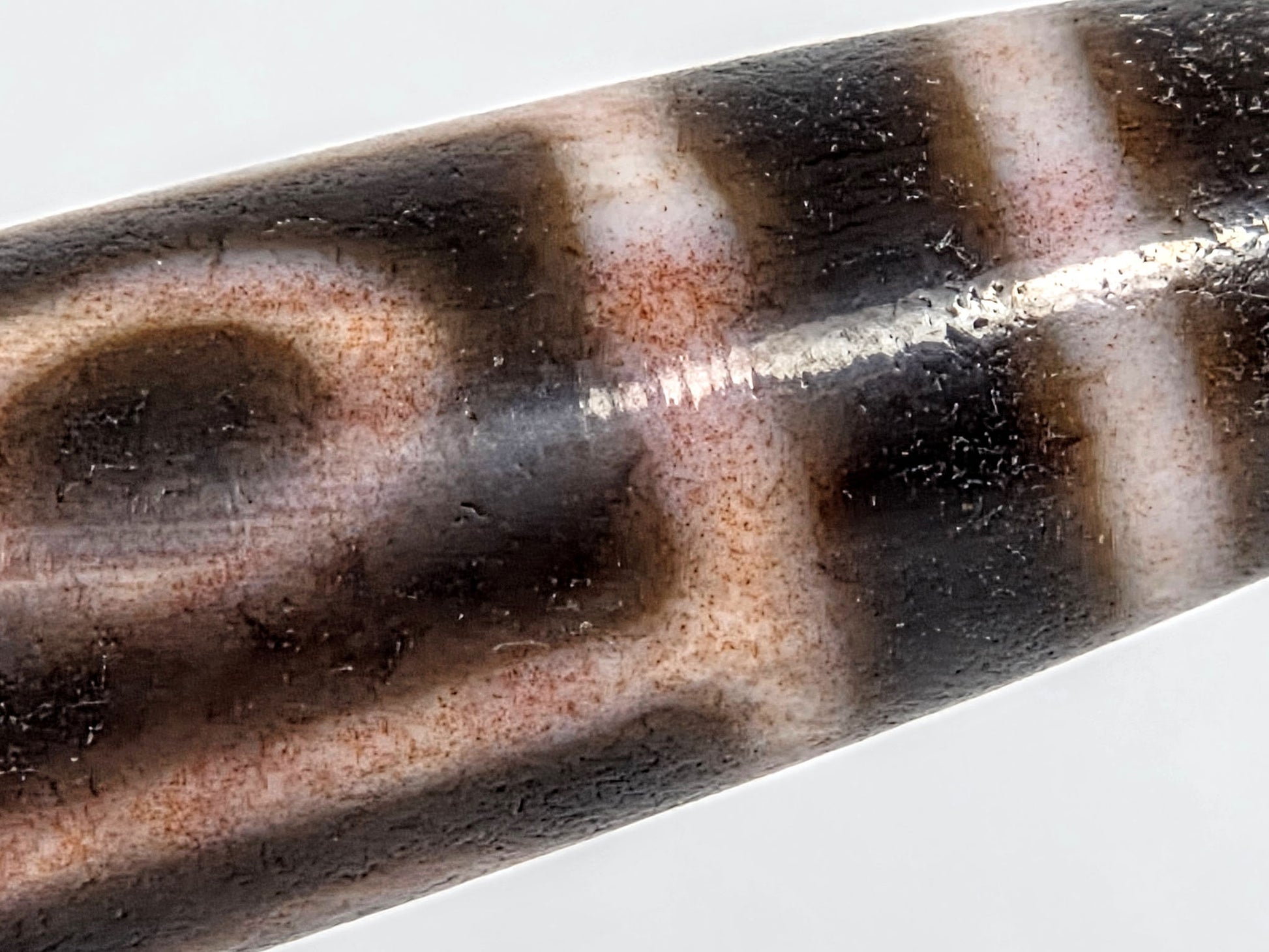 At-062926-9EBS macro 1, fine russet-red cinnabar inclusions in cream-peach zone, surface texture visible, unretouched