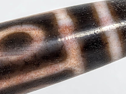 At-062926-9EBS macro 1, fine russet-red cinnabar inclusions in cream-peach zone, surface texture visible, unretouched