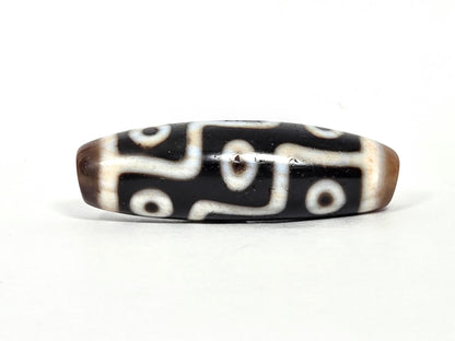 At-070626-9EBS antique nine eye dzi face C, deep black agate, cream S-curve and stepped eye network, warm brown end caps, unretouched