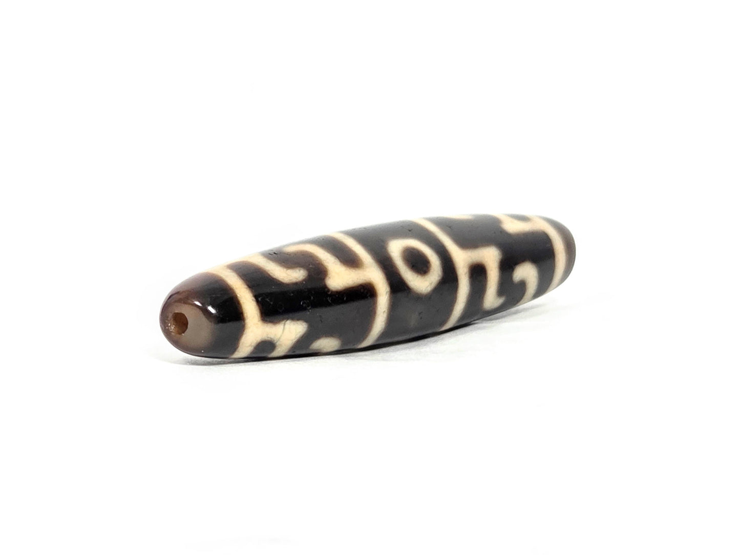 At-070826-GRRP3E antique Guru Rinpoche paraphernalia three eye dzi opposite end angled view dark brown agate unretouched