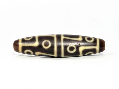 Ac-070826-12E ancient twelve eye dzi bead chocolate-brown agate second face rotated view cream motif unretouched