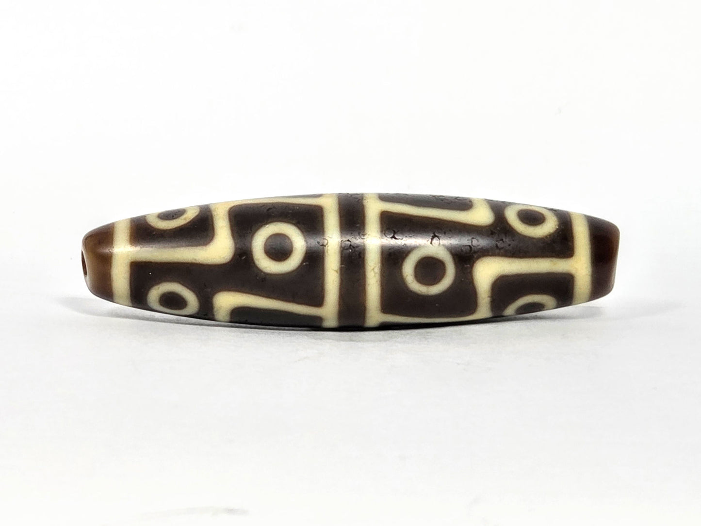 Ac-070826-12E ancient twelve eye dzi bead chocolate-brown agate third face angled with drill end visible unretouched